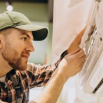 repairman-doing-air-conditioner-service