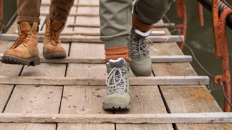close-up-couple-s-feet-wooden-bridge_23-2148693719