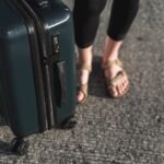 close-up-tourist-with-suitcase_23-2148328865