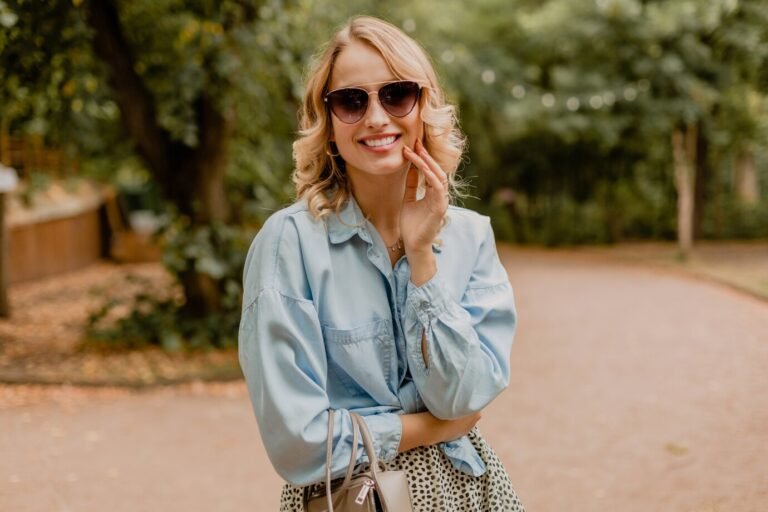attractive-blond-smiling-woman-walking-park-stylish-outfit_285396-8178