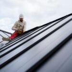 full-shot-man-working-roof-with-hammer_23-2149343667