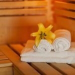 close-up-fresh-towels-yellow-lily-sauna_329181-1877