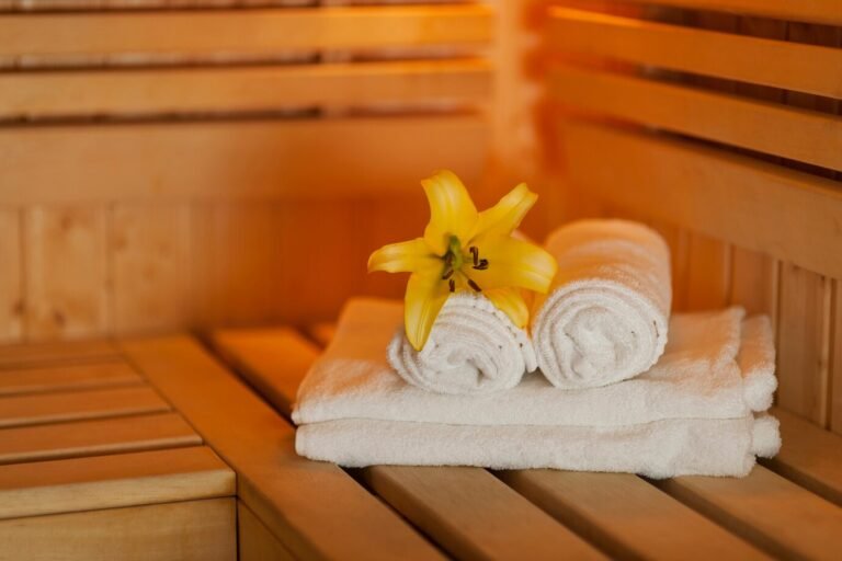 close-up-fresh-towels-yellow-lily-sauna_329181-1877