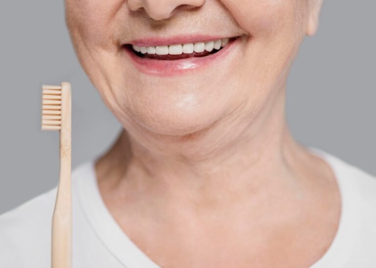 close-up-woman-holding-toothbrush_23-2148803477